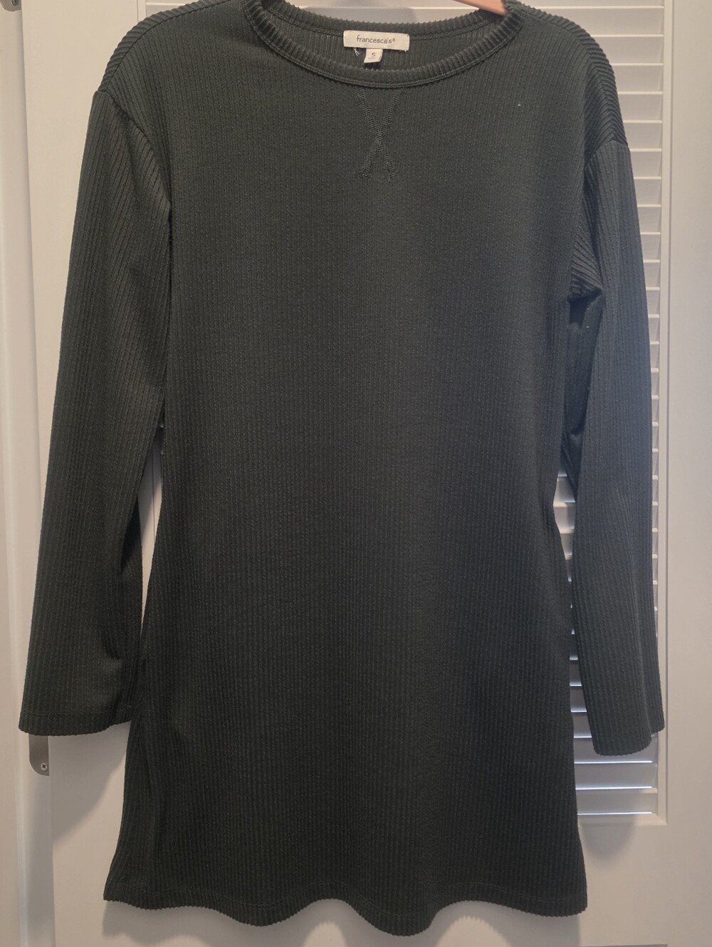 Francesca's dark green ribbed long-sleeve mini dress.